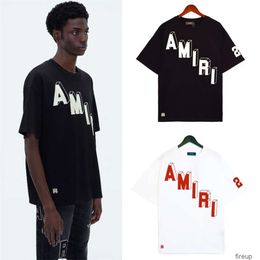 Designer Fashion Vêtements Hommes Tees Tshirt Amires Printemps Automne Nouveau Bloc 3D Logo Lettre Impression High Street Casual Lâche Hommes Femmes T-shirt à manches courtes