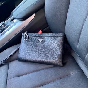 Pochette noire et sac à langer de luxe pour homme en cuir véritable