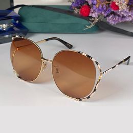 Diseñador gradiente polarizado gafas de sol para mujer marco redondo moda gafas de sol para mujer lujo para mujer nuevo marco de metal vintage con caja GG0595S