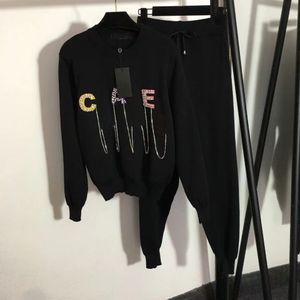 Designer de haute qualité Athleisure Pantalon de deux pièces pour femmes Mode Col rond Manches longues Lettre Logo Décalque Sweat à capuche en tricot Pantalon long Ensemble de deux pièces