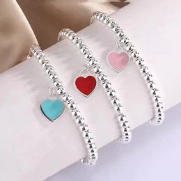 Designer Infinity Bangle Luxury Couple ￩ternel Bracelet Boules de coeur Boules de coeur Boules Bracelets pour femmes Bracelets de charme rose bleu vert
