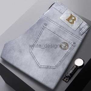 Jeans de créateurs pour hommes jeans européens jeans élastique élastique slim slim small pieds droits mode pantalon gris pour hommes lavés à la mode