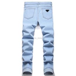 Jeans de diseñador para hombres nuevos jeans azul color elástico delgado fit pantalones tendencias casuales pantalones de moda marca de bordado desgarrado