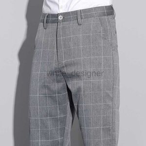 Jeans de designer pour hommes printemps / été pour le pantalon occasionnel à carreaux masculins.