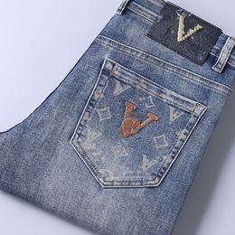 Jeans de diseñador para hombres Jeans delgados para hombres estiramiento de la marca de moda delgada Jeans Logotipo de lujo Pantalones de jeans apilados Pantalones Men y mujeres Pantociones de motocicleta de mezclilla casual