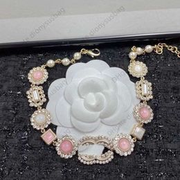 Collier de bijoux de créateur nouveau tempérament élégant petit diamant de tournesol rose suspendu Double chaîne de cou vent de luxe qualité