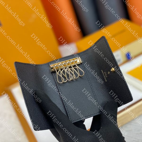 Diseñador Llavero Monedero Clásico Cuero Negro 6 Bolsa de llaves Hombres Mujeres Letra Llaves en relieve Paquete de soporte de cadena con caja Regalo de Navidad de lujo Mini billetera