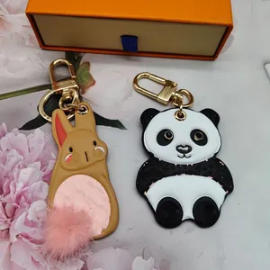 Designer Porte-clés Anneaux Panda Lapin Lapin En Peluche Pompon Brun Fleur Animal Voiture Porte-clés Mignon À La Main En Cuir Femmes Sac Pendentif Charme Porte-clés Bijoux