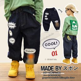 Designer Kids Monkey Letter Gedrukte jeans jongens losse casual denim broek 2024 lente kinderen cartoon cowboy broek z7522