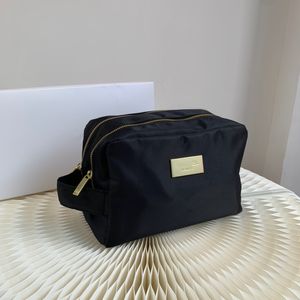 Bolsa de cosméticos negra de diseñador para mujer, bolsa de almacenamiento de maquillaje con base de lápiz labial de escritorio, bolsa de lavado con logotipo clásico de moda de viaje, bolsa de cosméticos portátil de alta calidad