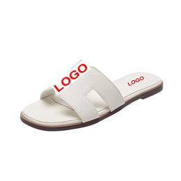Designer lederen dames sandalen 2024-5 zomer plat schoenen mode strand dames slippers letter drag
