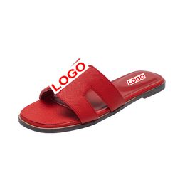 Designer lederen dames sandalen 2024-6 zomer plat schoenen mode strand dames slippers letter drag