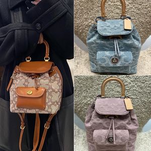 Bolso de equipaje de diseñador, bolso de viaje de moda para hombres y mujeres, bolso de gran capacidad, mochila de cuero de vaca con patrón bordado clásico, bolso de embarque