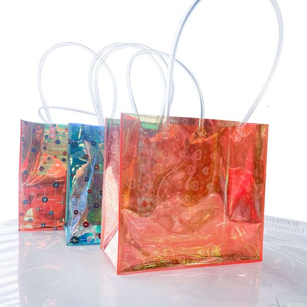 Bolsos de lujo de diseñador Venta al por mayor Playa de verano Mujeres Bolso de mano transparente con hombro impermeable Pvc colorido transparente