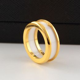 Diseñador de moda de lujo 316L anillo de amor de acero de titanio Anillos de oro rosa de acero inoxidable para los amantes regalo de pareja de cerámica blanca negra