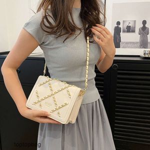 Designer Sacs à bandoulière de mode de luxe Sac français frais et à la mode pour femmes populaire sur Internet en 2023 Même style chaîne croix diamant grille design unique épaule