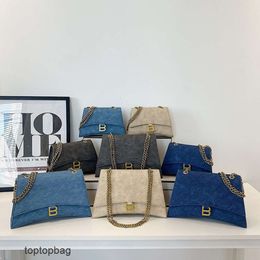 Diseñador de moda de lujo Bolsas de asas Bolsa de reloj de arena de moda de lujo francesa 2023 Nuevo estilo occidental versátil Bolso de mujer con cadena cruzada de un hombro