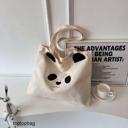 Designer Luxe mode draagtassen Koreaanse versie van artistieke en casual panda canvas tas 2023 nieuwe modieuze en minimalistische schoudertas