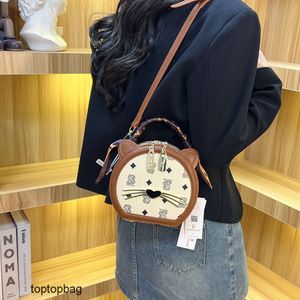 Designer Luxe mode draagtassen Portefeuilles Mode Kleine Ronde Tas 2023 Nieuwe Mode Trend Handheld Kat Hoofd Ontwerp Damestas Enkele Schouder Crossbody Tas