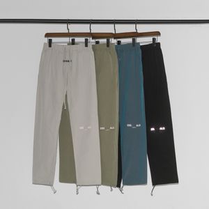 Designer Men's's Pants Nylon Tissu Reflective Reflective Logo High Street Cargo Style Colorful Drawstring Nylon Casual Colters