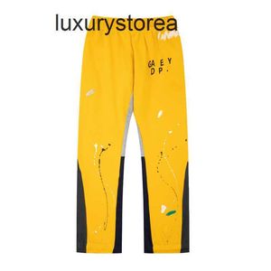 Designer Men Pantalon de jambe large lettre pour hommes Impression de mode de mode Pantalon long décontracté arc-en-ciel jogger jogger rayures cordon jaune l6