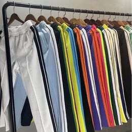 Diseñador pantalones para hombre hombres sueltos otoño deportes de invierno pantalones largos pantalones pantalones de chándal para hombres casuales letras impresas lados de jogger rayas deportivas