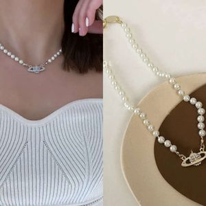 Collier de créateur, collier de perles Saturn classique, chaîne de clavicule baroque irrégulière pour femmes, conception de niche, collier européen et américain
