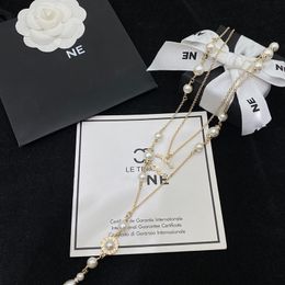 Collier de créateur colliers de créateurs de luxe pour femmes pull en perles chaîne charme or collier long tempérament de mode cadeau à la mode sympa