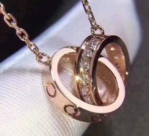 Colliers de créateurs Luxe Mode double anneaux pendentif Bijoux fête Argent pendentifs en diamant Or rose pour les femmes Cadeau de bijoux de mariage Colliers d'amour