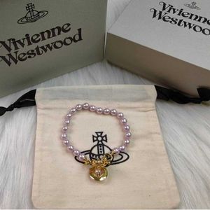 Ontwerper Originele afbeelding van Westwood High Board Pink Pearl Saturn Bracelet