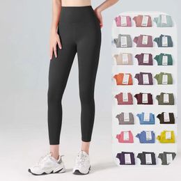 Pantalones de diseño Pantallas para mujeres Leggings Top Pants de yoga Longitud de la rodilla Capris Gimnasio Legging de cintura alta fitness elástica Ladera de chándal al aire libre