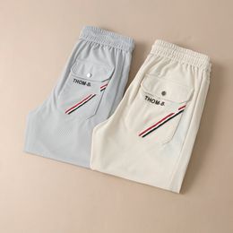 Designer pantalons mens tpants TB 2023 printemps / été compteur nouvelle mode hommes élégants haut personnalisé pantalons décontractés d'affaires unique printemps / été pantalons décontractés minces