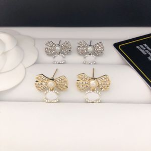 Designer Pearl Bowknot Charm Boucles d'oreilles LECTURE LEXURIE LETTRE LECTURE SILLE GOLD GOLD SEARDUDLESSEUX ACIER MODIE OEUEUR LORME BOUCLE DE RUBLOGE INSCRIE