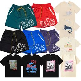 Diseñador Rhude camiseta pantalones cortos para hombre pantalones cortos de playa para mujer camisas de manga de algodón casual camisetas versátiles camisa de secado rápido pantalones cortos de malla transpirable de alta calidad