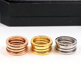 Anillos de diseñador anillos de primavera de gama alta para hombres y mujeres anillos de cerámica clásicos de lujo parejas anillo de acero inoxidable regalos de joyería de diseñador