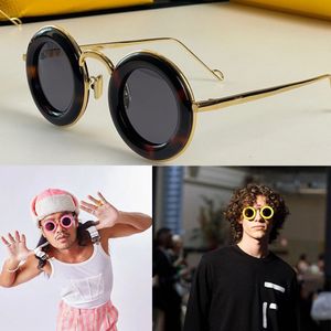 Diseñador gafas de sol redondas Mujeres de lujo gafas redondas personalizadas Marco circular patas de espejo de metal Hombres gafas de sol de fiesta al aire libre Occhiali da sole