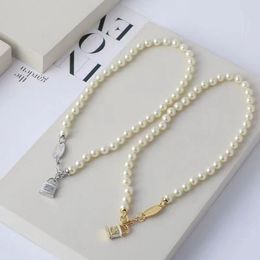 Collier de perles en résine laque, nouvelle marque Saturn de styliste, à serrure solide, à la mode et Noble