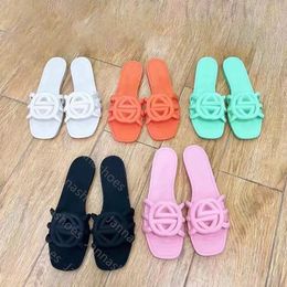 Sandalias de diseñador Mujeres entrelazadas de toboganes G zapatillas de goma de goma damas guión de playa plana guión de mulas de otoño de verano