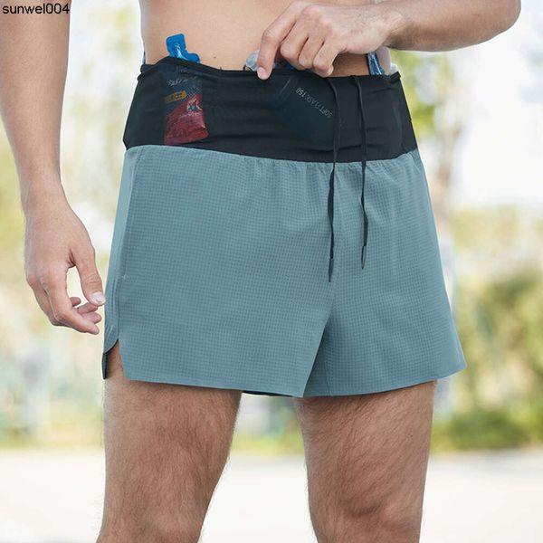 Pantalones cortos de diseño Nuevos pantalones cortos de explosiones para hombre falsos de dos piezas de doble capa Maratón de fondo Pantalones de entrenamiento para correr Secado rápido de tres partes