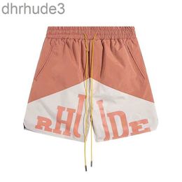 Pantalones cortos de diseñador Rhude Hombres Moda Nadar Mujeres Pantalones de gimnasio Casual Playa suelta para hombres para mujer DE5H