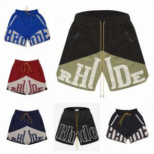 Pantalones cortos de diseñador Rhude, pantalones cortos de playa de moda de verano, ropa de calle de alta calidad para hombres, pantalones de baloncesto de cinco puntos de tamaño suelto, 86CU #