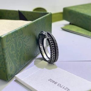 Diseñador serpiente de plata amor un anillo de cobre blanco para hombres y mujeres amantes de la moda anillos Parejas Anillos con caja hombres mujeres corazón Bague