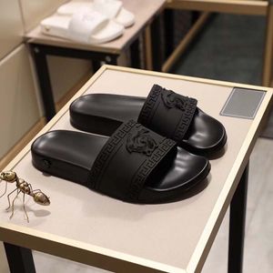 Zapatillas de diseñador Sandalias Palazzo para mujer Chanclas para hombre Zapatos de vestir de cuero de goma planos de lujo para mujer