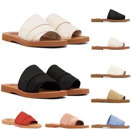 Designer Slippers Woody Sandals Letters Luxury merk modieuze vrouwen canvas dia's verstoppen muilezel plat sandalen comfortabel zomer buiten strand slippers 5a