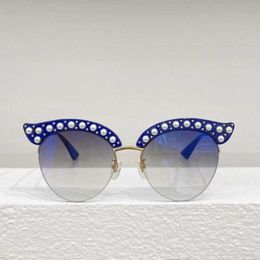 Gafas de sol de diseñador para mujeres NUEVOS Pearl Edge Cat Eye Grandeo grande Gafas de sol de metal Gradiente Medio marco Gafas de sol versátiles 0212s