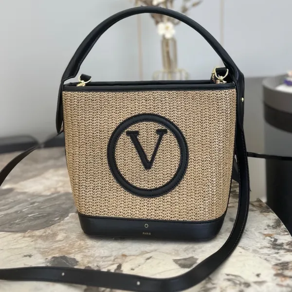 Bolso de mano de diseñador Bolso tejido para mujer Bolso de playa de verano 2023 Nuevo bolso tejido de hierba junto al mar Estilo pastoral Bolso tejido de vid portátil de gran capacidad