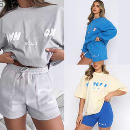Spares de pistas de diseño Sport 2 piezas Sweet Sweatsuit, camiseta suelta, pantalones con capucha con sudadera, juegos cortos para mujeres ropa ropa