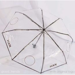 Parasols de créateurs parapluie transparent motif de lettre féminin pliant parapluie complet de la mode pour femmes.