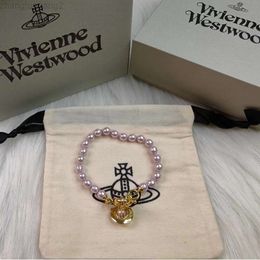 Designer Viviane Westwoods Vivienen Western Empress Dowager High Board Bracelet Saturne en perles roses