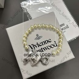 Diseñador Vivienen Westwoods New Viviane New Western Empress Dowager Love Pin Pearl Pearl Light Luxury Ins Sweet Cool Peach Heart Saturno 8410